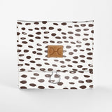 Roll Up Toiletry | Laminated Fabric with Genuine Leather Seeds - White / Chunky Zip Roll Up Toiletry Fabric by Thandana